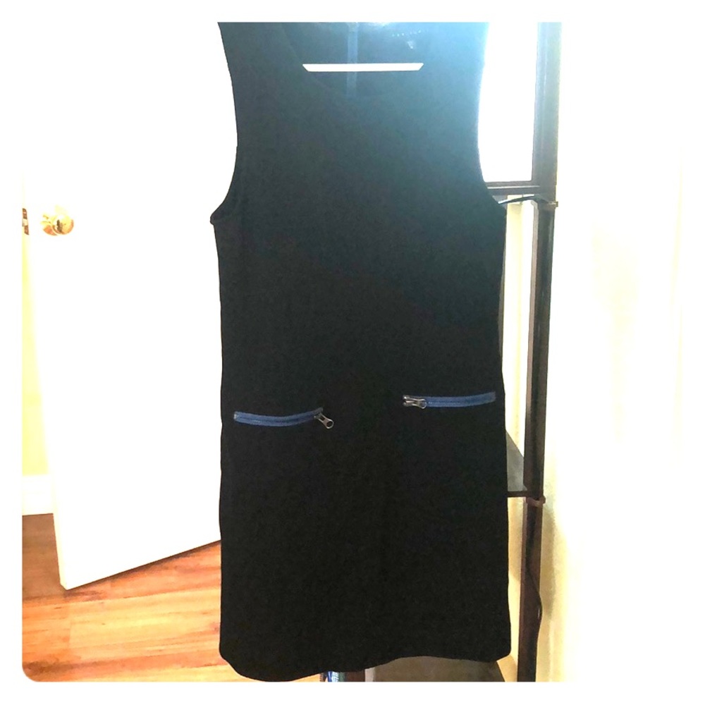 Black work dress with blue zippers at the hip